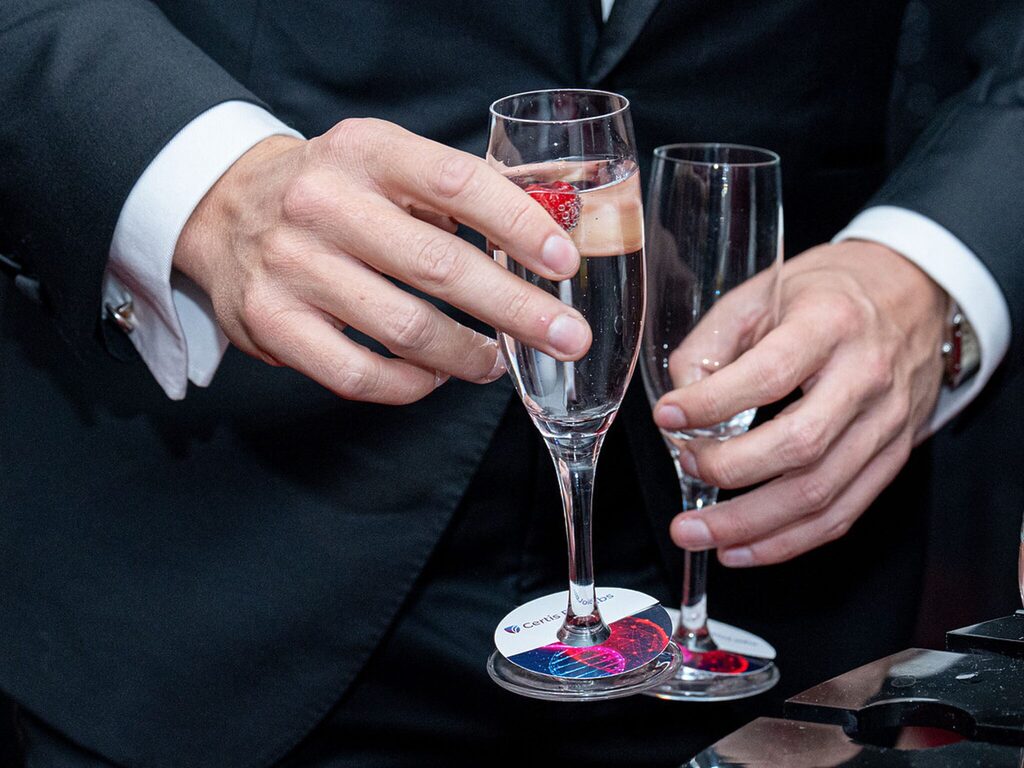 Man holding glasses as Certis Bio Labs receives an award.